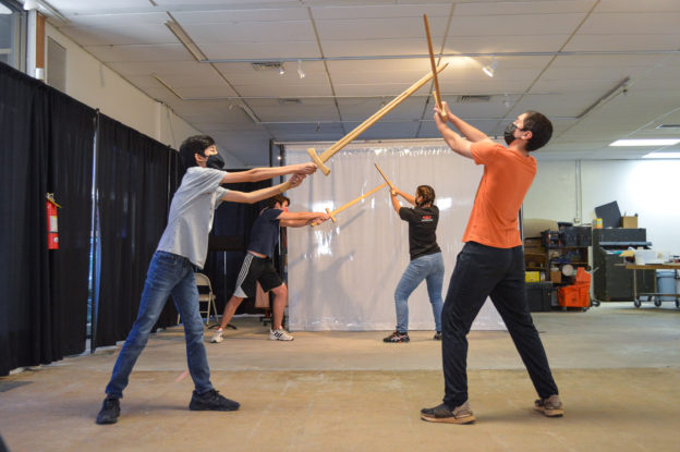 Students practicing sword attack drills