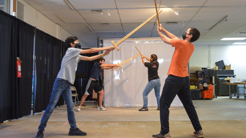 Students practicing sword attack drills